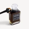 Anhänger in Form einer Parfüm-Miniaturflasche in Schwarz