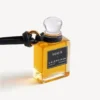 Anhänger in Form einer Parfüm-Miniaturflasche in Schwarz