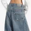 Baggy-Jeans für Damen mit tiefem Schritt in schmutzigem Vintage-Blau Baggy-Jeans für Damen mit tiefem Schritt in schmutzigem Vintage-Blau