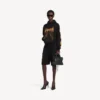 Balenciaga Sacra Cœur Hoodie für Damen in schwarzer Farbe mit mittlerer Passform Balenciaga Sacra Cœur Hoodie für Damen in schwarzer Farbe mit mittlerer Passform