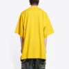 Balenciaga x THE SIMPSONS Oversized-Baumwoll-T-Shirt „Yellow“ 676589TLVG77200