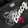Damen-Handtasche „Rodeo“ klein mit Anhängern in Schwarz