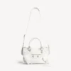 Damen-Tasche „Le City“ klein mit riesigen Nieten und Strasssteinen in Optikweiß Damen-Tasche „Le City“ klein mit riesigen Nieten und Strasssteinen in Optikweiß