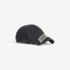 Herren-Kappe im Masking-Tape-Look in verblasstem Schwarz Herren-Kappe im Masking-Tape-Look in verblasstem Schwarz