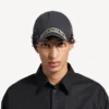 Herren-Kappe im Masking-Tape-Look in verblasstem Schwarz Herren-Kappe im Masking-Tape-Look in verblasstem Schwarz