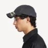Herren-Kappe im Masking-Tape-Look in verblasstem Schwarz Herren-Kappe im Masking-Tape-Look in verblasstem Schwarz