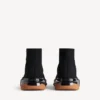 Herren-Sneaker „Speed 2.0“ mit vollständig transparenter Sohle aus recyceltem Strick in Schwarz/Orange